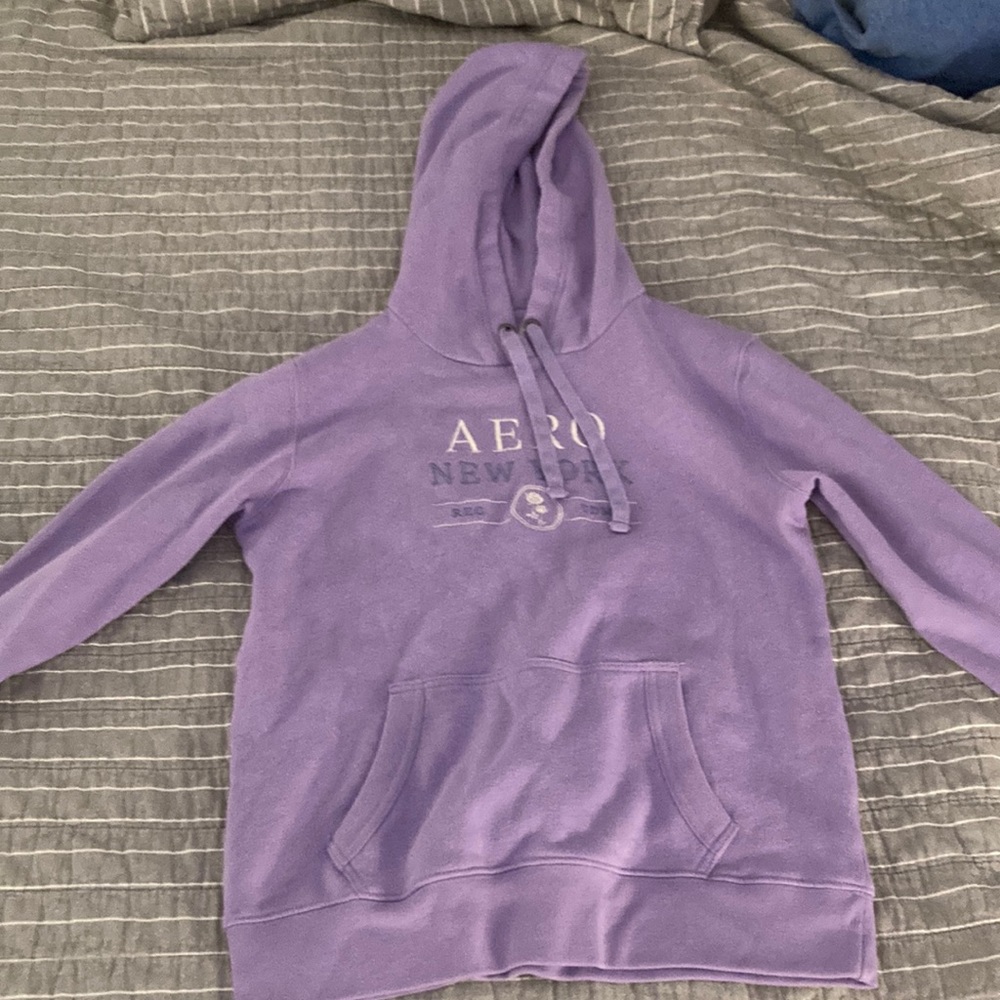 This is a fitted purple sweatshirt